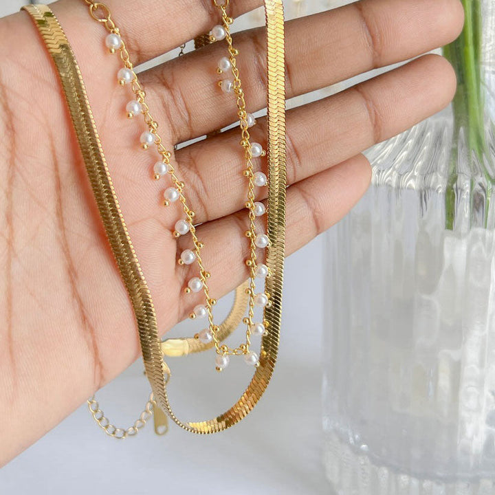 Marizanne™ Pearl Jewellery Set by Emma & Rose Cape Town featuring elegant pearl earrings and necklace on a white background.