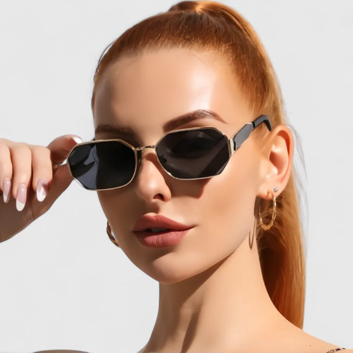 Black Jaylynne™ elegant sunglasses by Emma & Rose Cape Town with a sleek frame and tinted lenses.