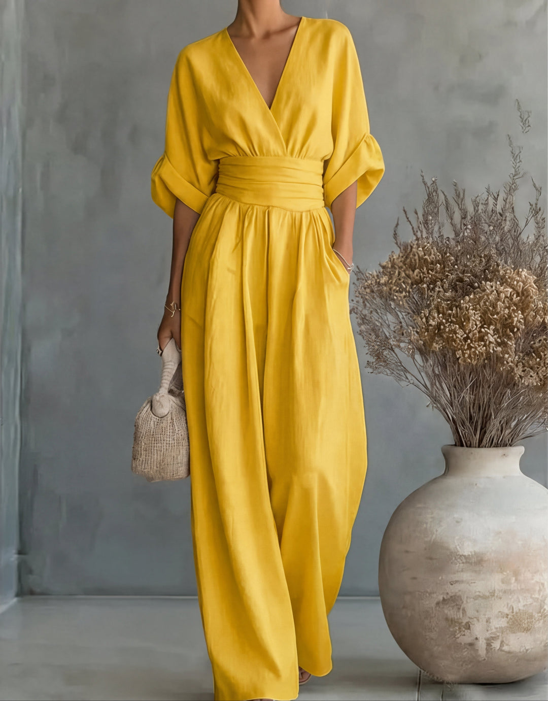 Emma & Rose Cape Town Daniela V-neck jumpsuit with wide legs, elegant white design, stylish and comfortable for sophisticated occasions.