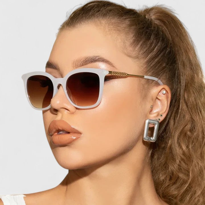 Emma & Rose Cape Town Savanuhh™ stylish white sunglasses with rounded frames and tinted lenses, perfect for a chic summer look.