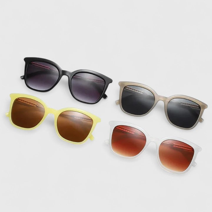 Emma & Rose Cape Town Savanuhh™ stylish white sunglasses with sleek frames and tinted lenses, fashionable eyewear for sunny days.