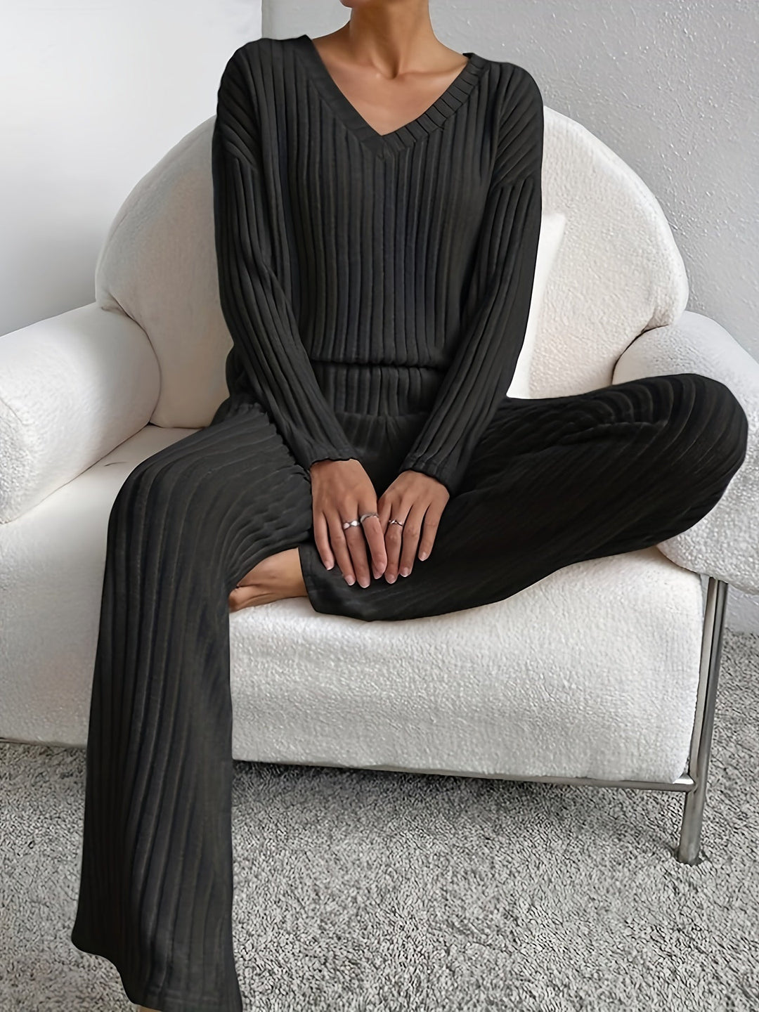 Black women's Chill Knit Lounge Set from Emma & Rose Cape Town, featuring a comfortable relaxed fit and cozy knit fabric.