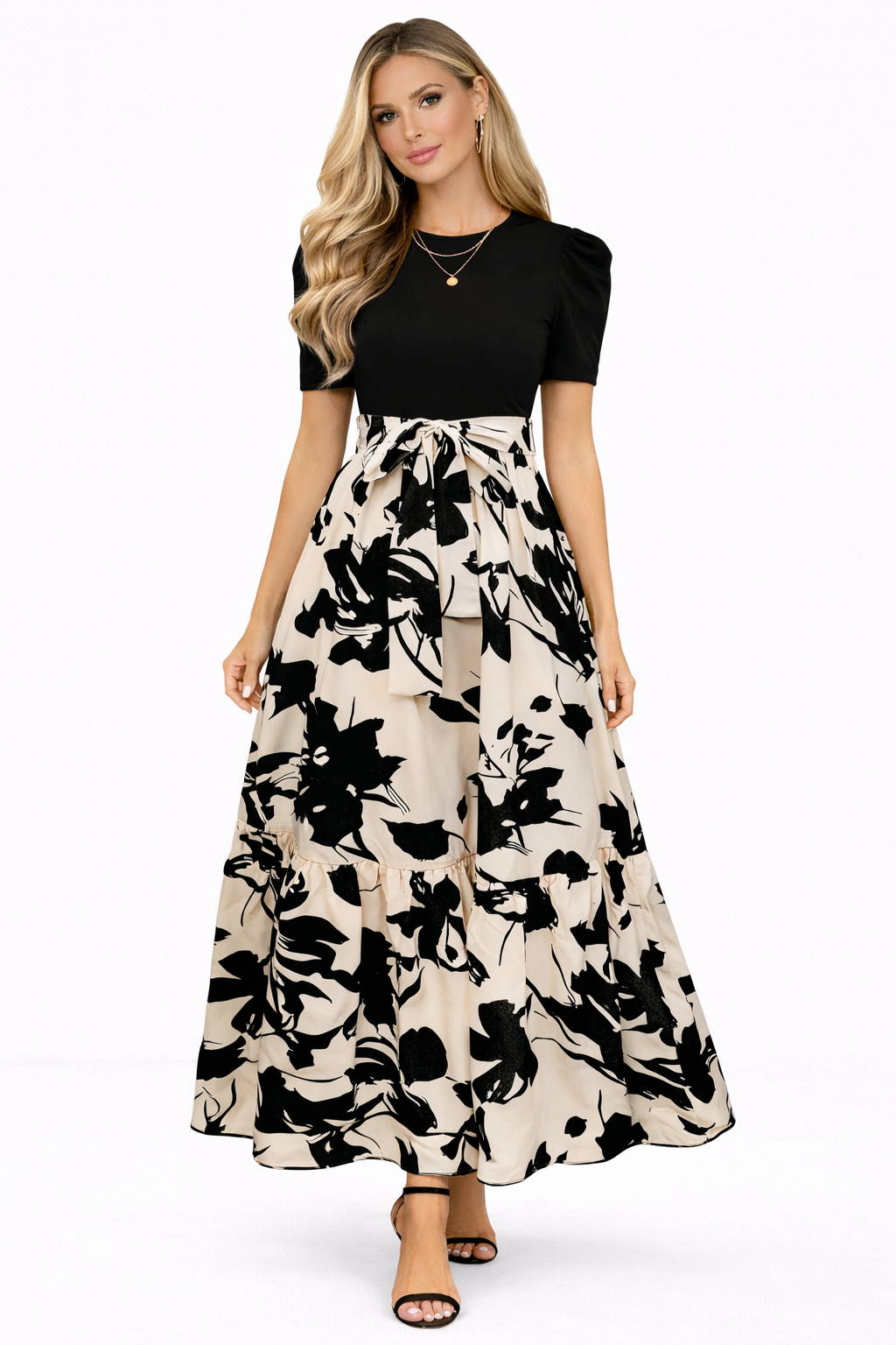 Elegant Ainhoa dress by Emma & Rose Cape Town featuring floral patterns and ruffled details, shown on a model.