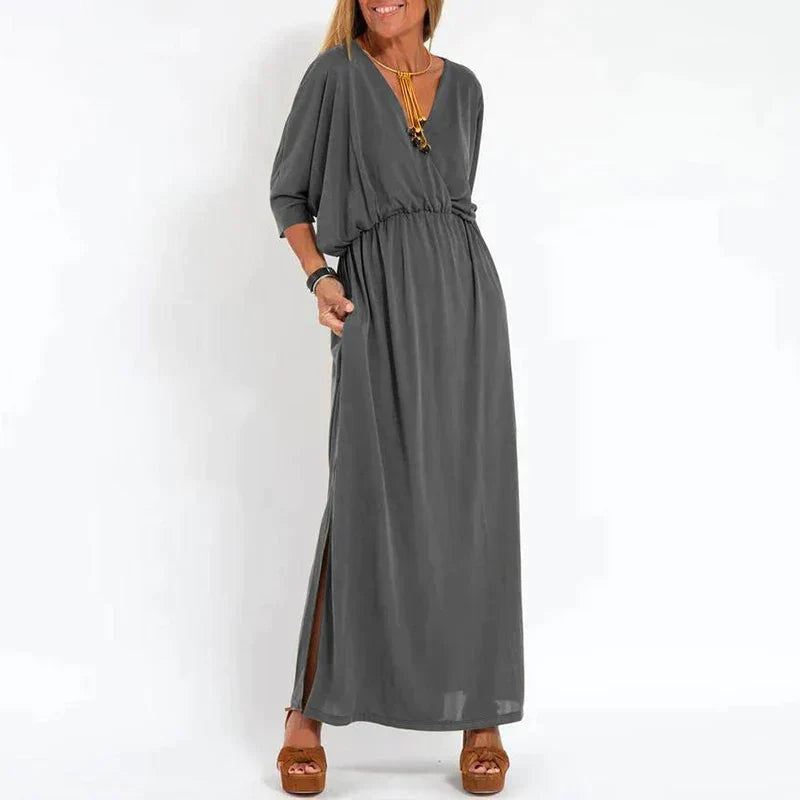Light gray Emilia™ maxi dress for women by Emma & Rose Manhattan, flowing fabric with a relaxed, elegant fit.
