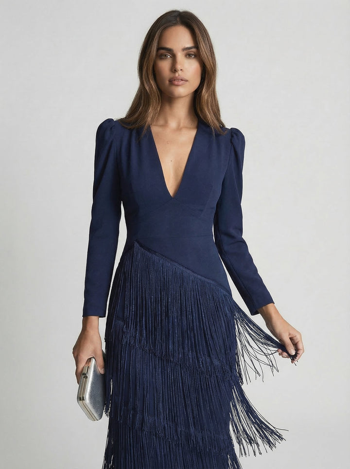 Sage green fringe dress by Emma & Rose Cape Town featuring flowing fabric and stylish fringe details on a model.