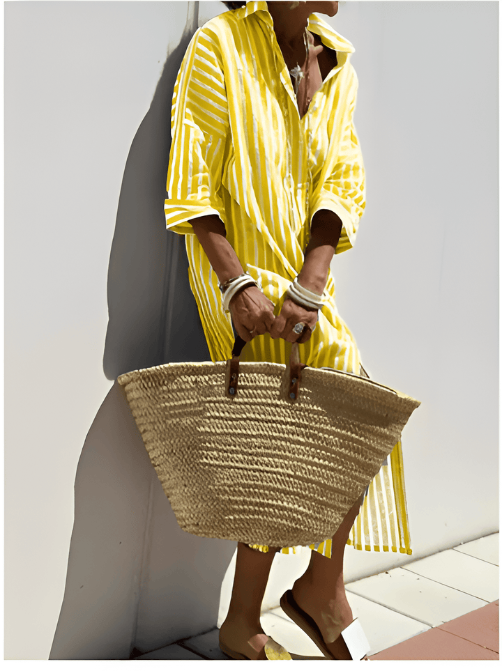 Héloïse™ elegant striped shirt dress by Emma & Rose Manhattan displayed on a hanger with a relaxed fit and classic collar.