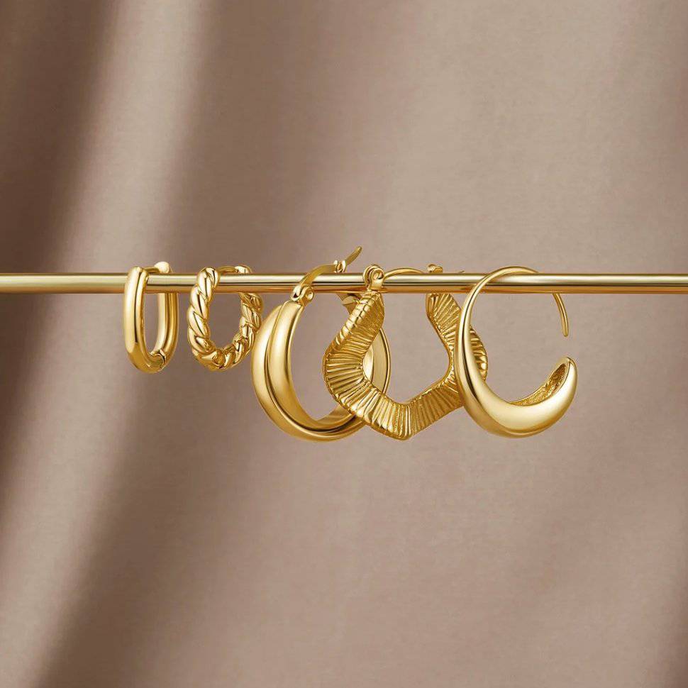 Gold twist earrings from Emma & Rose Cape Town's Krystal™ Stylish Twist Earrings collection, featuring elegant, intertwined design.