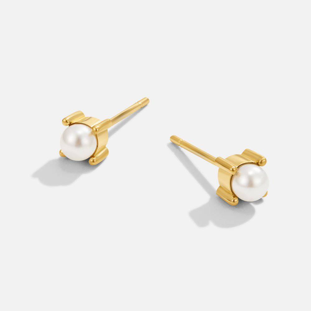 Emma & Rose Cape Town Rebb™ stylish pearl stud earrings featuring classic white pearls on silver posts.