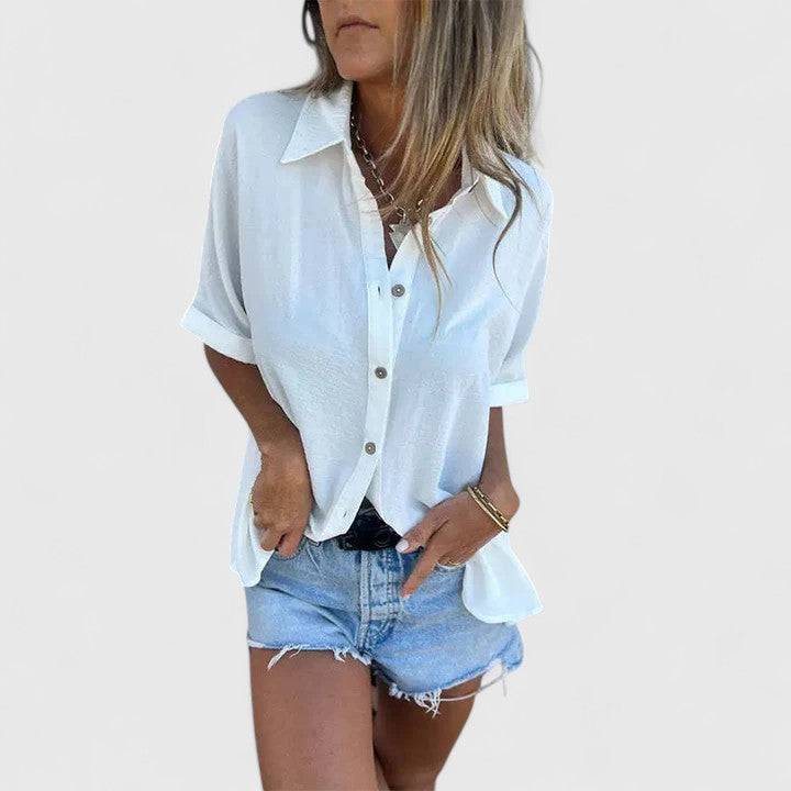Amber™ Elegant Blouse by Emma & Rose Cape Town, featuring a stylish design with flowing fabric and delicate details.