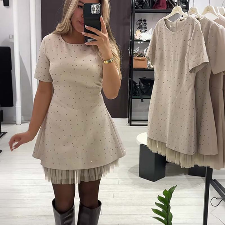 Elegant Eve™ mini dress by Emma & Rose Durban featuring a stylish, fitted design and intricate fabric details.
