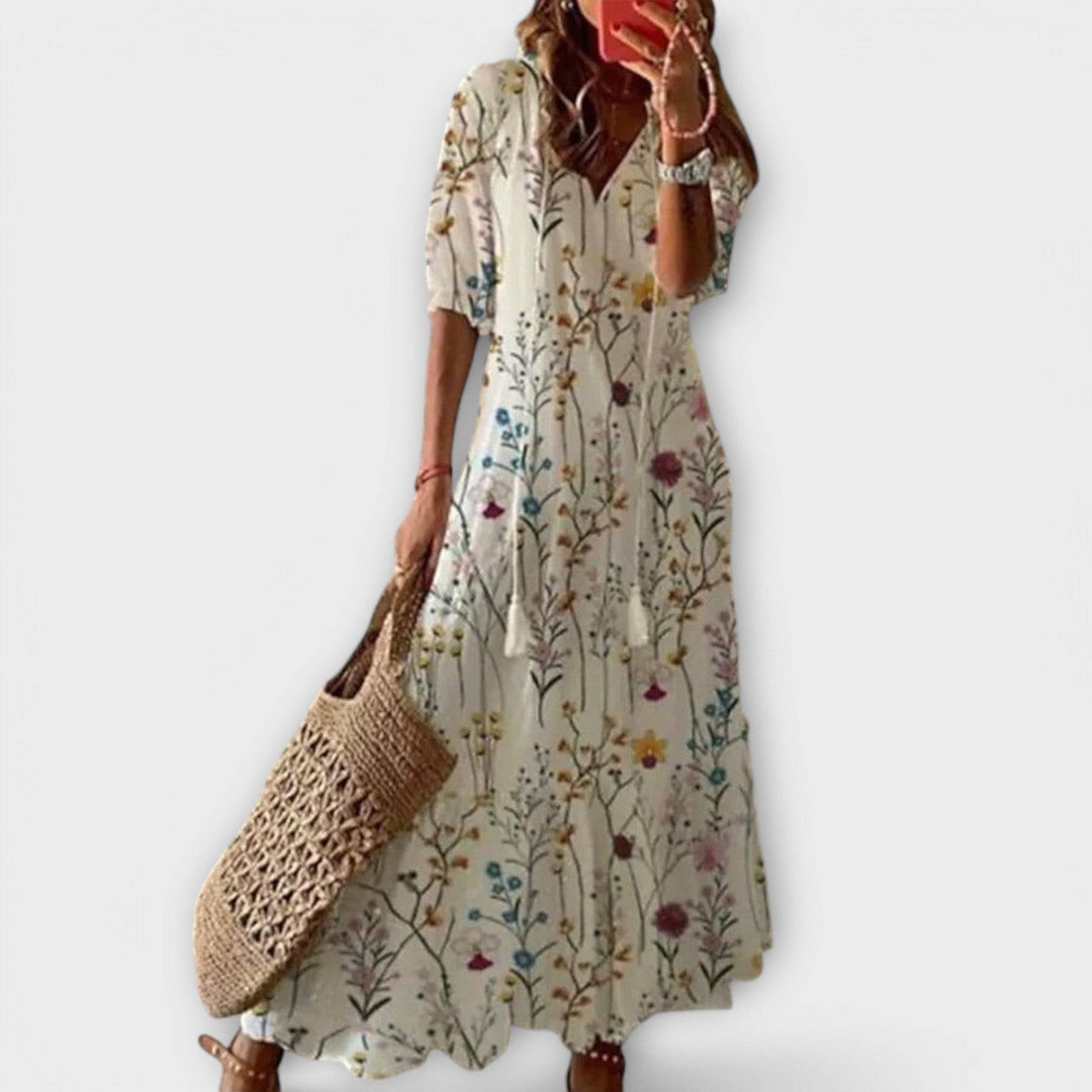 Elegant Savannah™ maxi dress by Emma & Rose Cape Town in a colorful multi-variant, flowing fabric with a stylish silhouette.