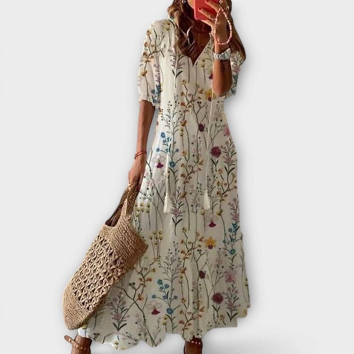 Elegant Savannah™ maxi dress by Emma & Rose Cape Town in a colorful multi-variant, flowing fabric with a stylish silhouette.