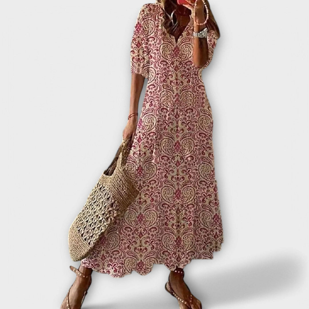 Pink Savannah™ elegant maxi dress by Emma & Rose Cape Town, flowing fabric and fitted waist, displayed on a mannequin.