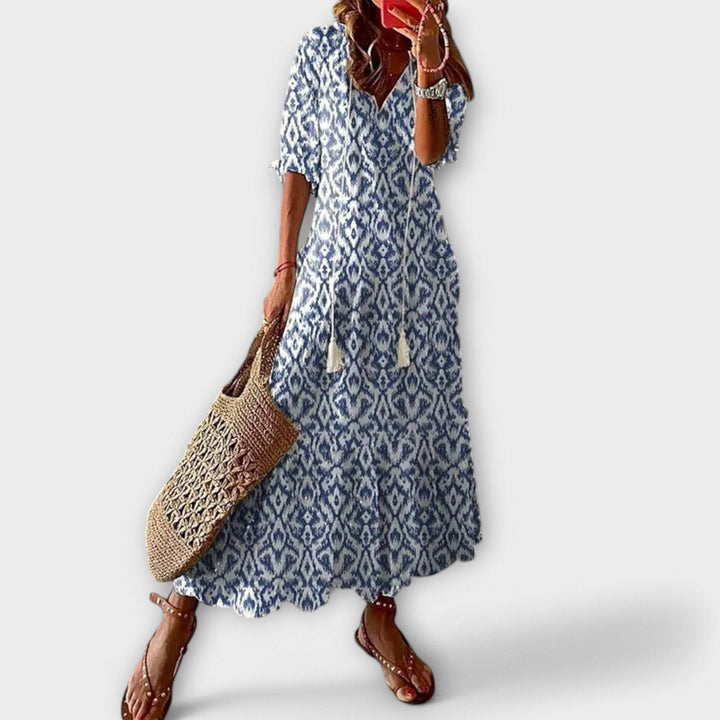Sky blue Savannah™ elegant maxi dress by Emma & Rose Cape Town, flowing fabric and stylish design, shown on a model.